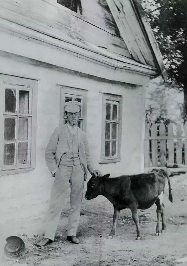 Mikhail Pavlovich Chekhov with a calf