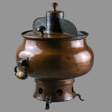 A charcoal-fueled cooking samovar