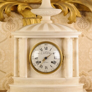 White marble mantel clock. Dubois.