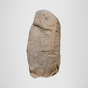 Stela with a face of an ancient deity