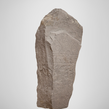 Stela depicting a schematic mask