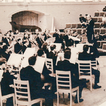 Sergei Prokofiev conducting an orchestra