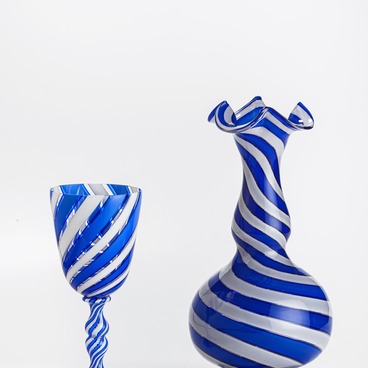 Stemmed glass and a vase