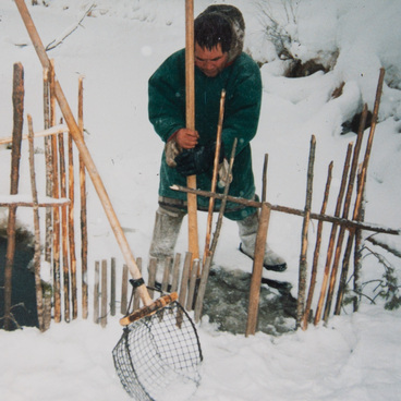 Winter fishing. Setting the fishing muzzle