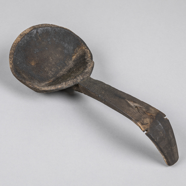 Carved wooden ladle. Yukh pen