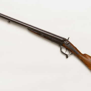 C. Lancaster side lock hammer shotgun